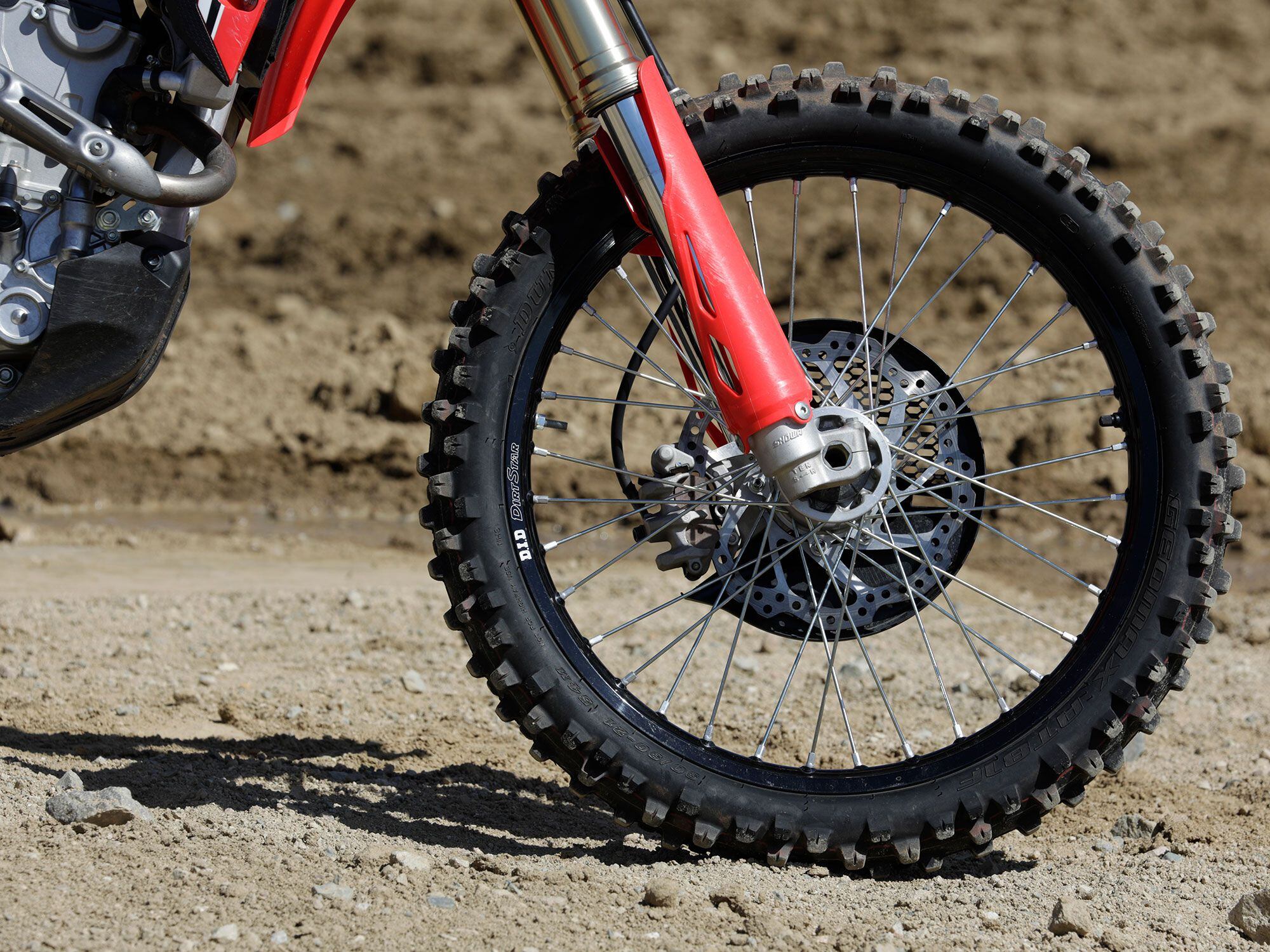 The CRF250RX rolls on a conventional 21-inch spoked rim shod with Dunlop’s versatile Geomax AT81 rubber.