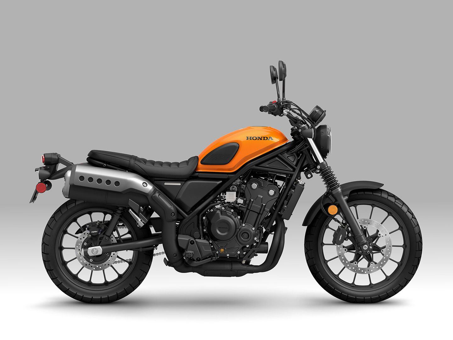 High pipes with 19-inch front and 17-inch rear tires add to the scrambler character of the Honda SCL500.