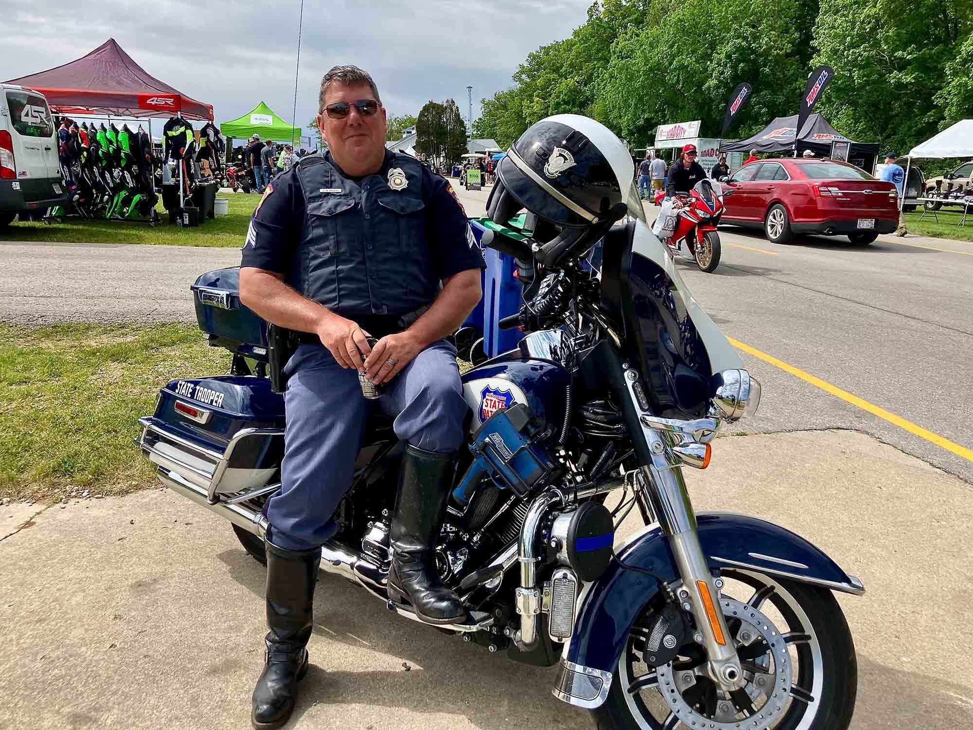 Ensuring orderly fun: Wisconsin State Patrol Motor Officer Holtz, pulling a plum assignment.