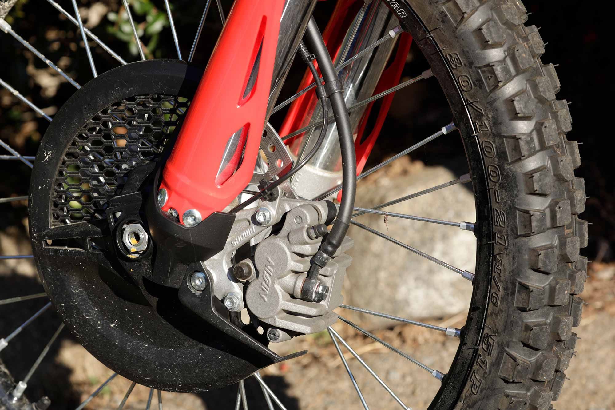 Dual hydraulic disc brakes keep speed in check on the 2021 CRF450RL.
