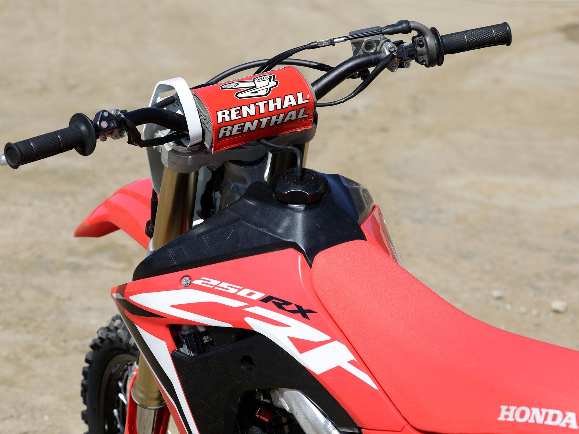 In typical dirt bike form, the CRF250RX uses an upright Renthal handlebar that can be moved forward or rearward depending on rider preference.