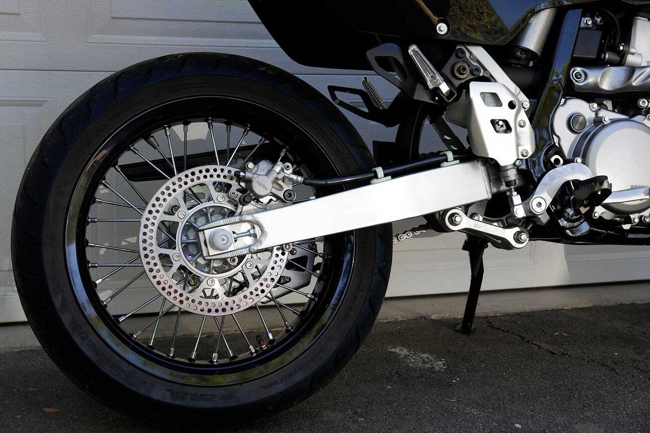 The DR-Z400SM trades a 21/18-inch wheel combo for a set of 17-inch Excel wheels. The wheels have tubes and are shod with Dunlop’s Sportmax D208 supermoto rubber.