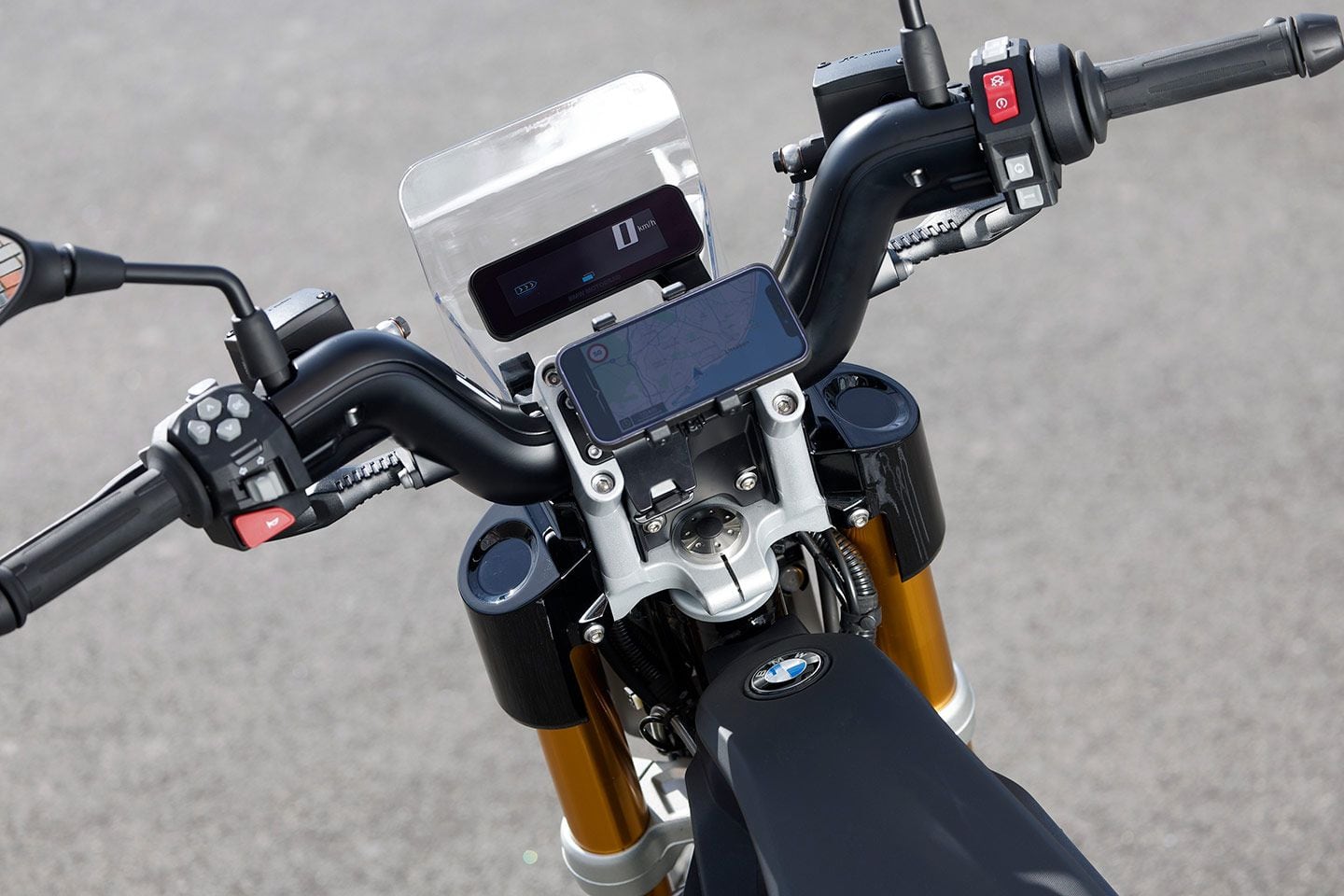 The cockpit looks pretty well optimized for the urban jungle with high bars, various ride modes, stability control, and yep, a smartphone holder.