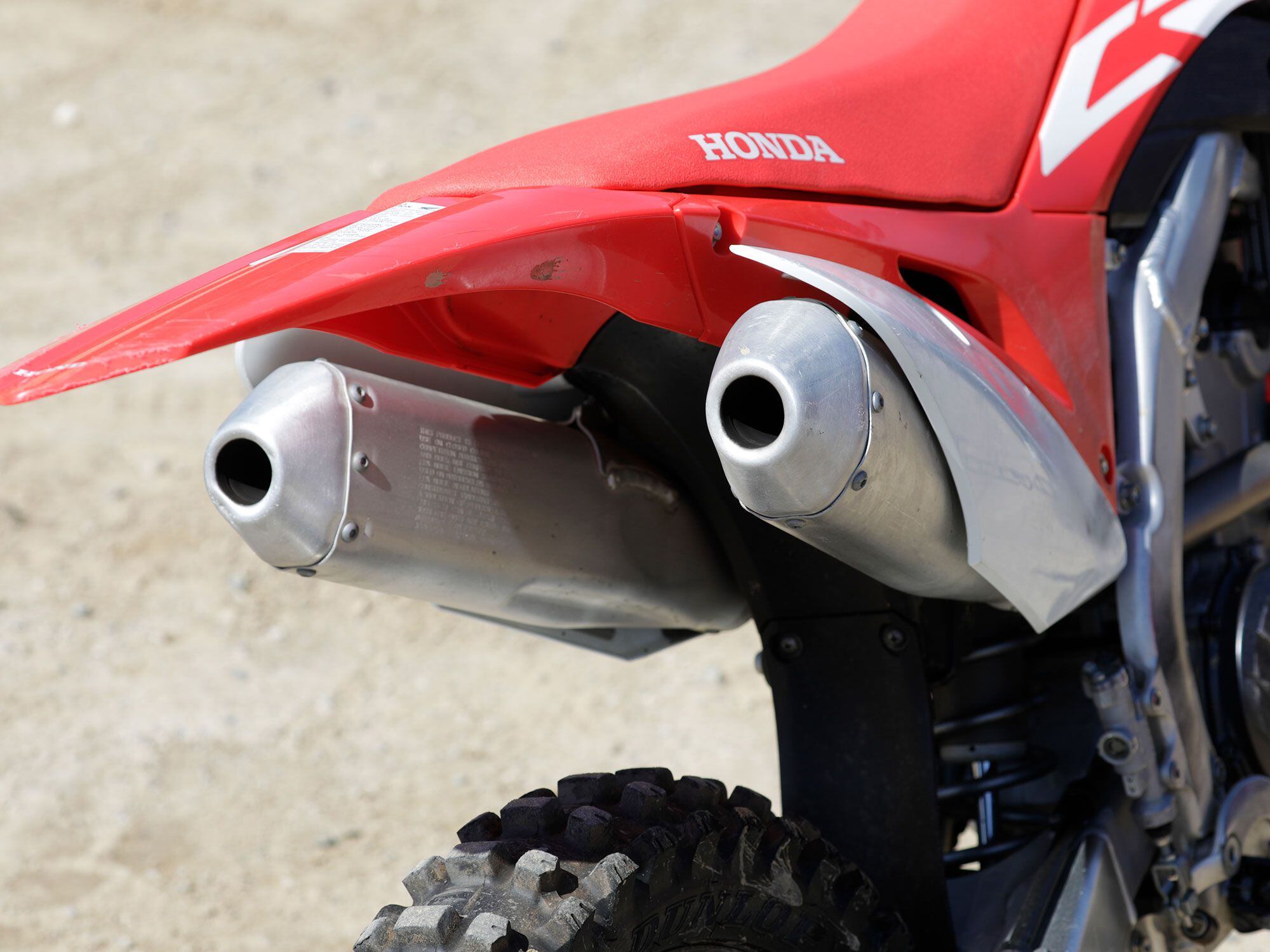 The CRF250RX uses Honda’s signature twin muffler setup. Big Red says it creates a more balanced motorcycle. We just think it looks (and sounds) cool.