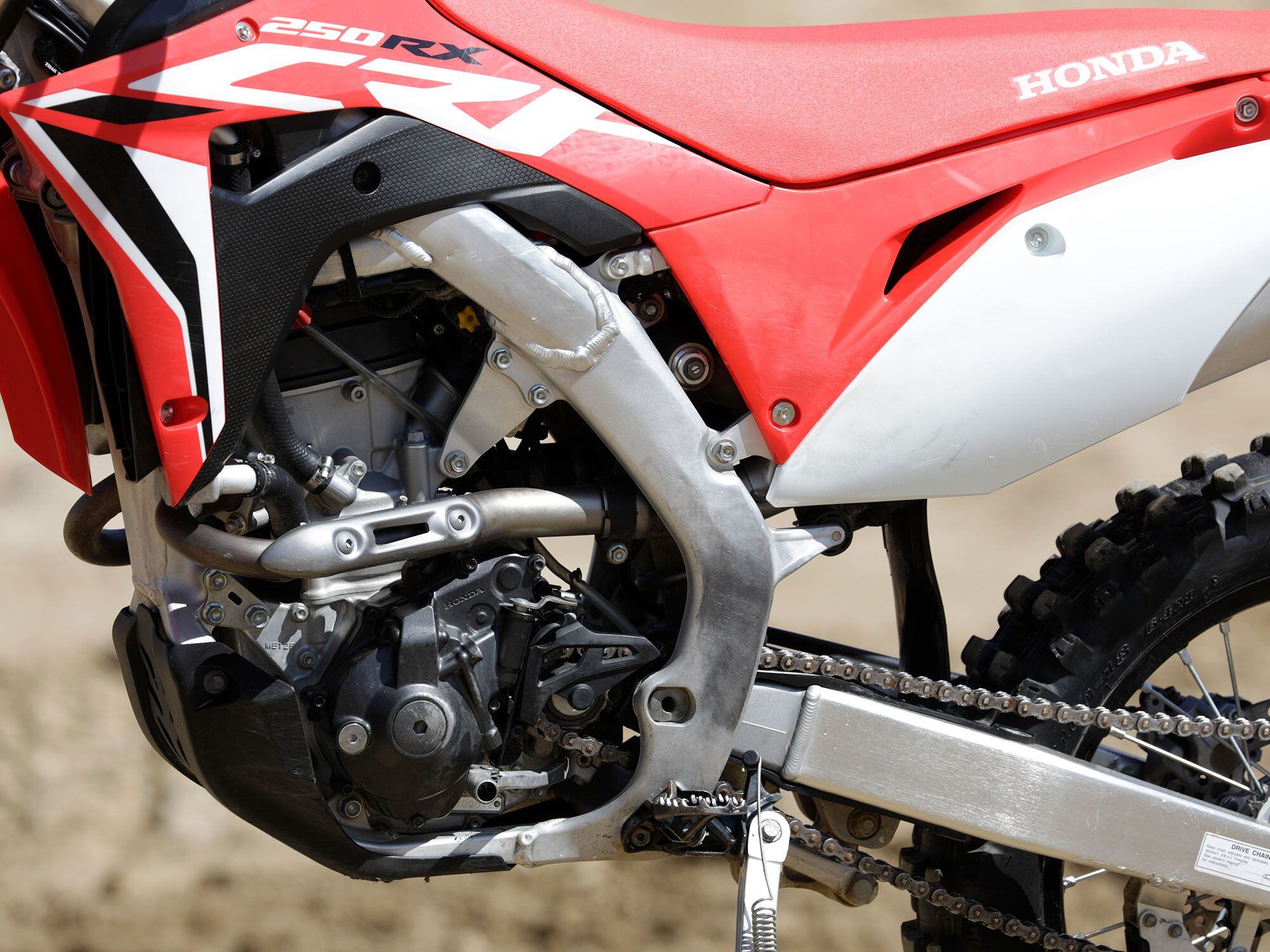 The 2021 CRF250RX uses a liquid-cooled 249cc single. Fuel-injection and electric start make it easy to get the engine lit.