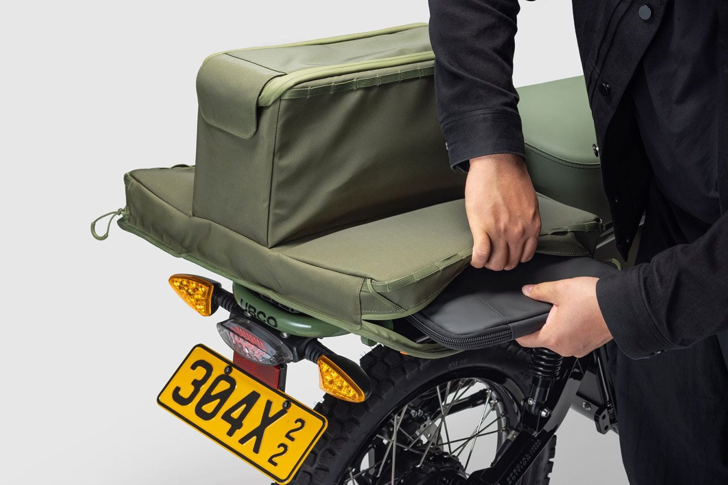 Waterproof tail bag folds out for increased storage, up to 30-liter capacity.