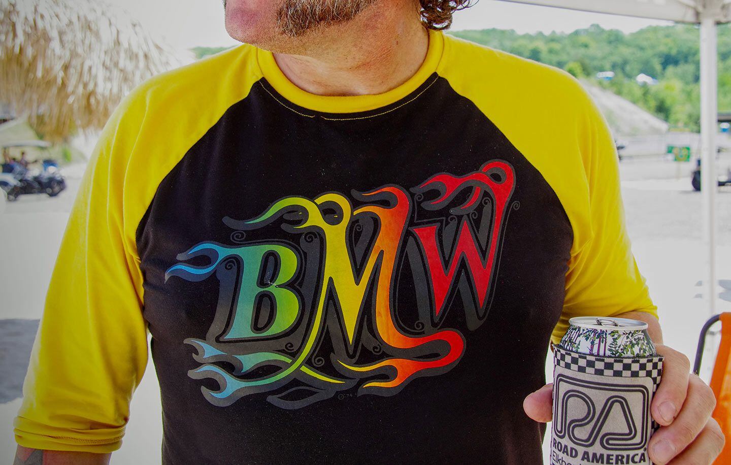BMW riders love flames too. Andrew McCarthy modeling a new line of BMW-themed apparel.