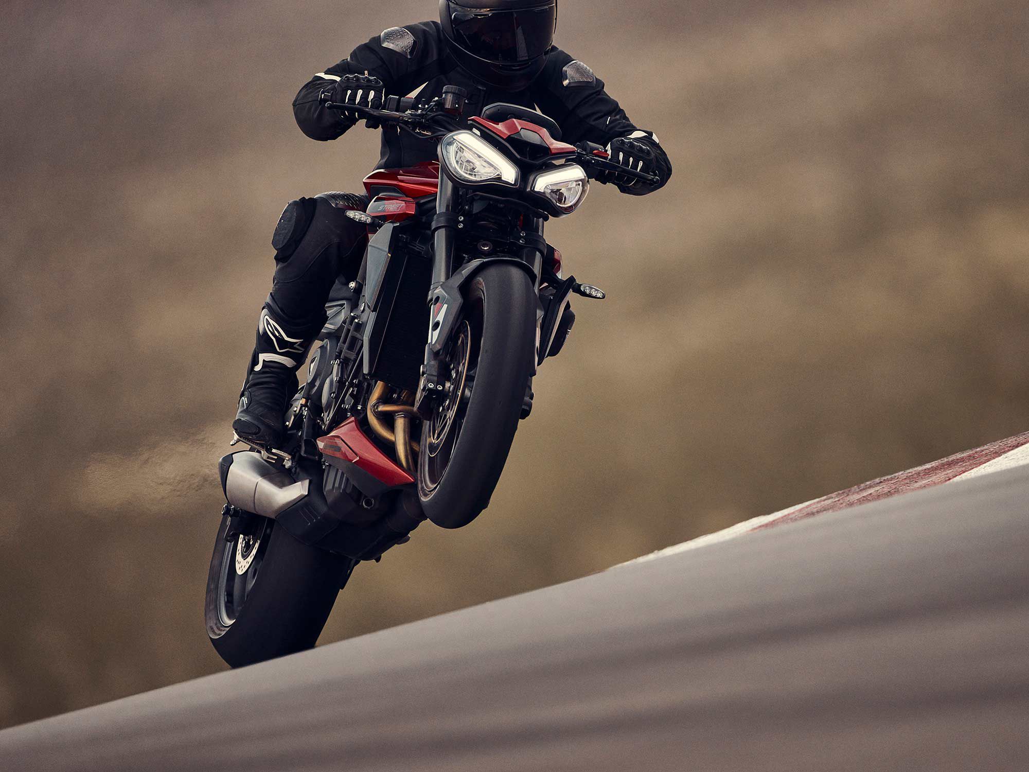 The Street Triple 765 RS showing off track mode and wheelie, simultaneously.