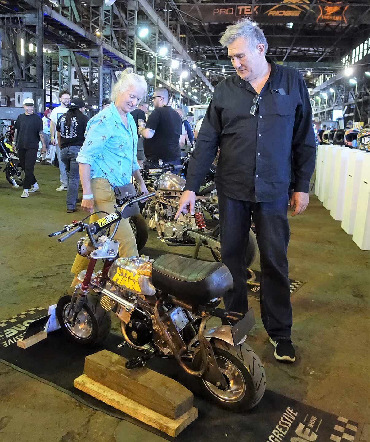 The One Moto draws some of the best designers in the biz. Here Piaggio’s Miguel Galluzzi is checking out “Lil’ Man,” a Honda Z50 that won the Heavy Metal Award.