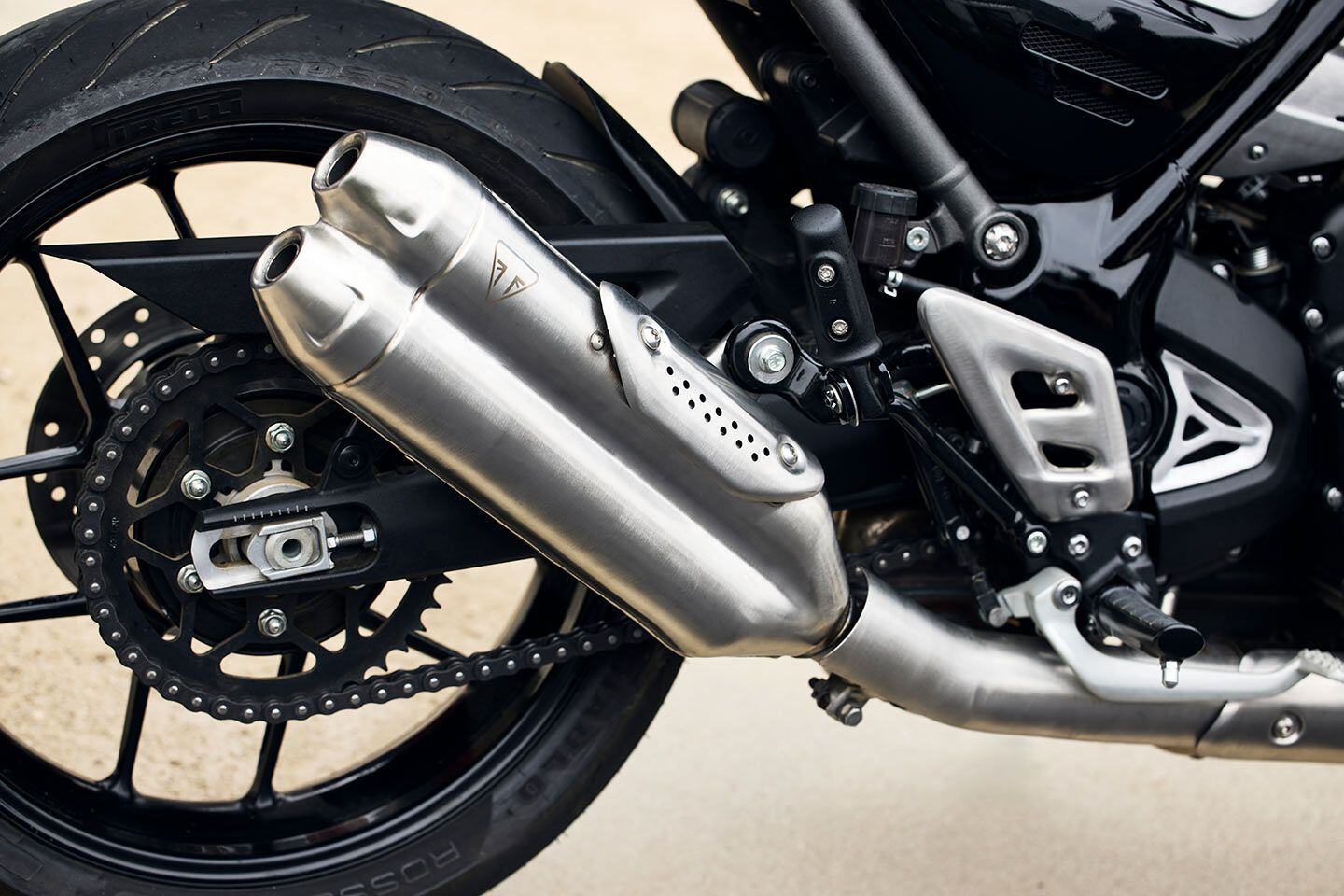 Detail of the entirely unnecessary twin-exhaust setup of the single-cylinder 2024 Triumph Speed 400.