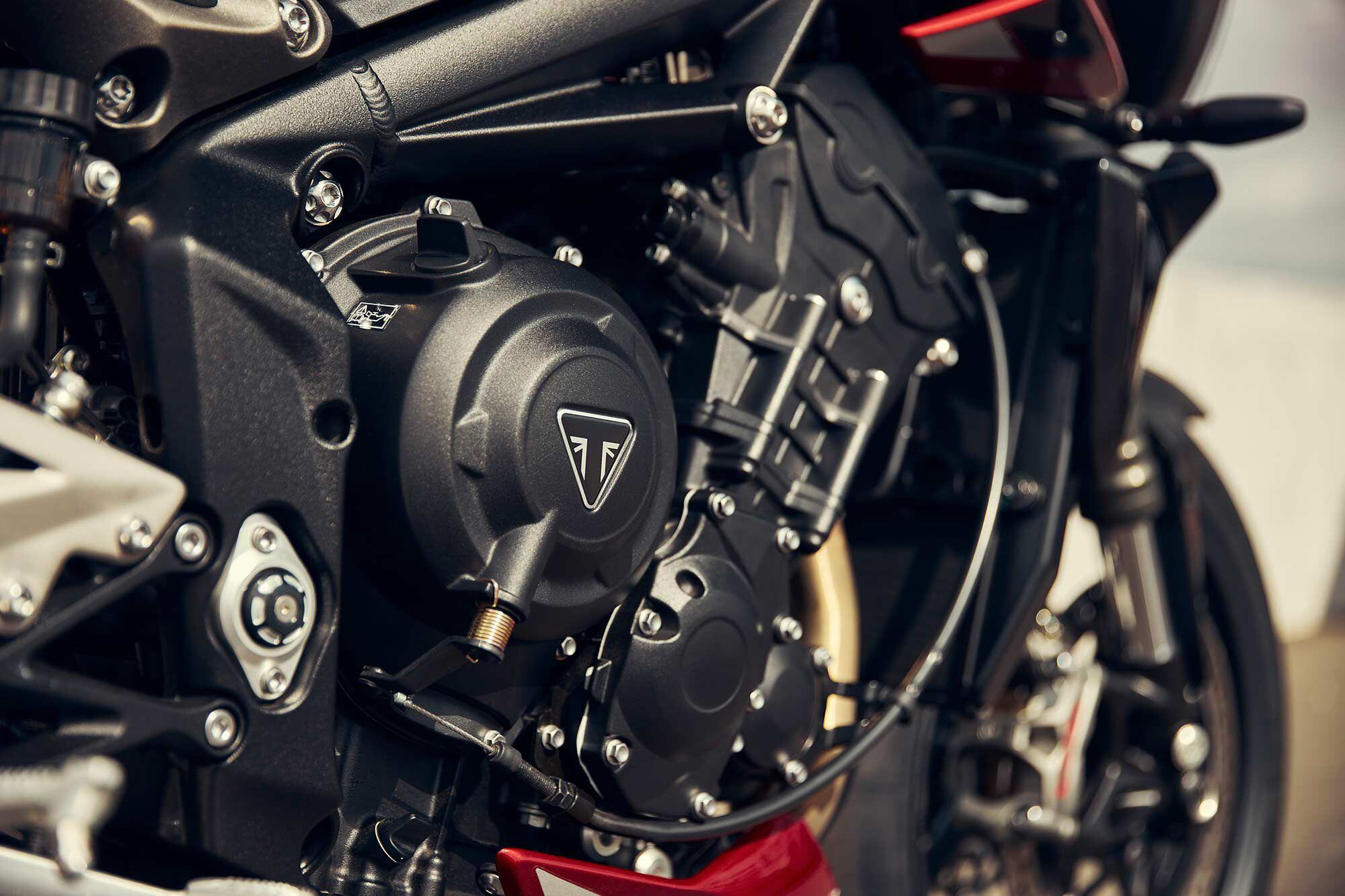 The starboard side of the Street Triple 765 RS, in Carnival Red and Carbon Black.