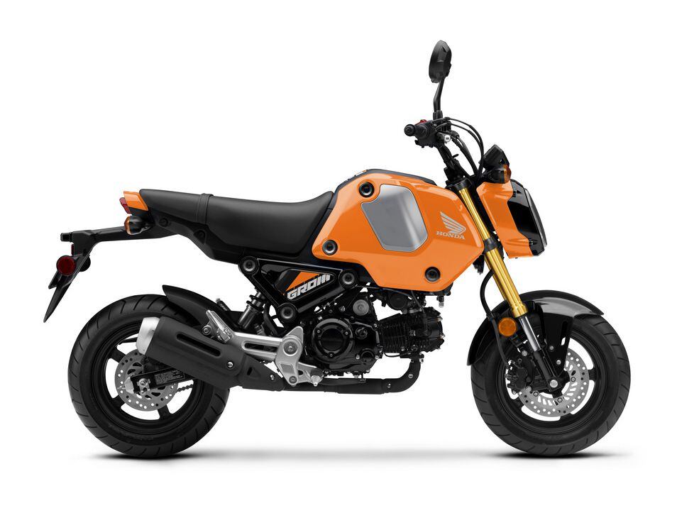 The Grom in Nitric Orange. This third-generation Grom revives the “cuter” styling of the original, backtracking from the second gen’s more aggressive, cyborg look.