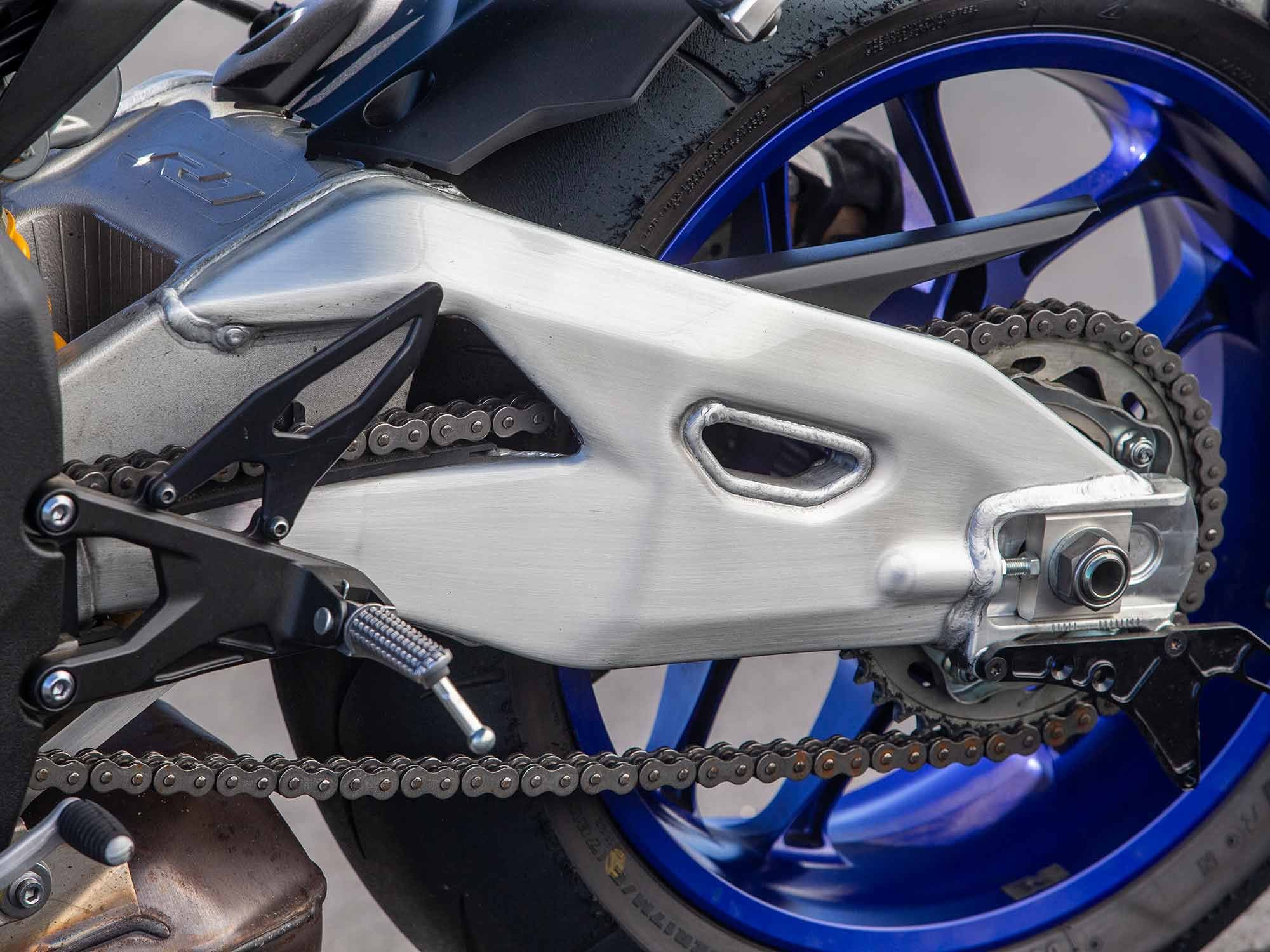 The YZF-R1M stands out with its polished aluminum swingarm versus the standard model’s painted piece.