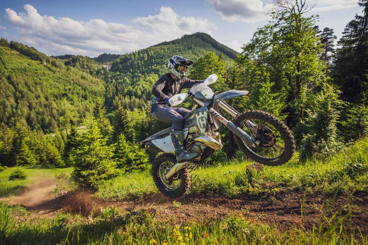 The hills are alive with the sound of brap. The two-stroke 2024 Husqvarna TE 300 Pro adding a little blue smoke to blue skies.