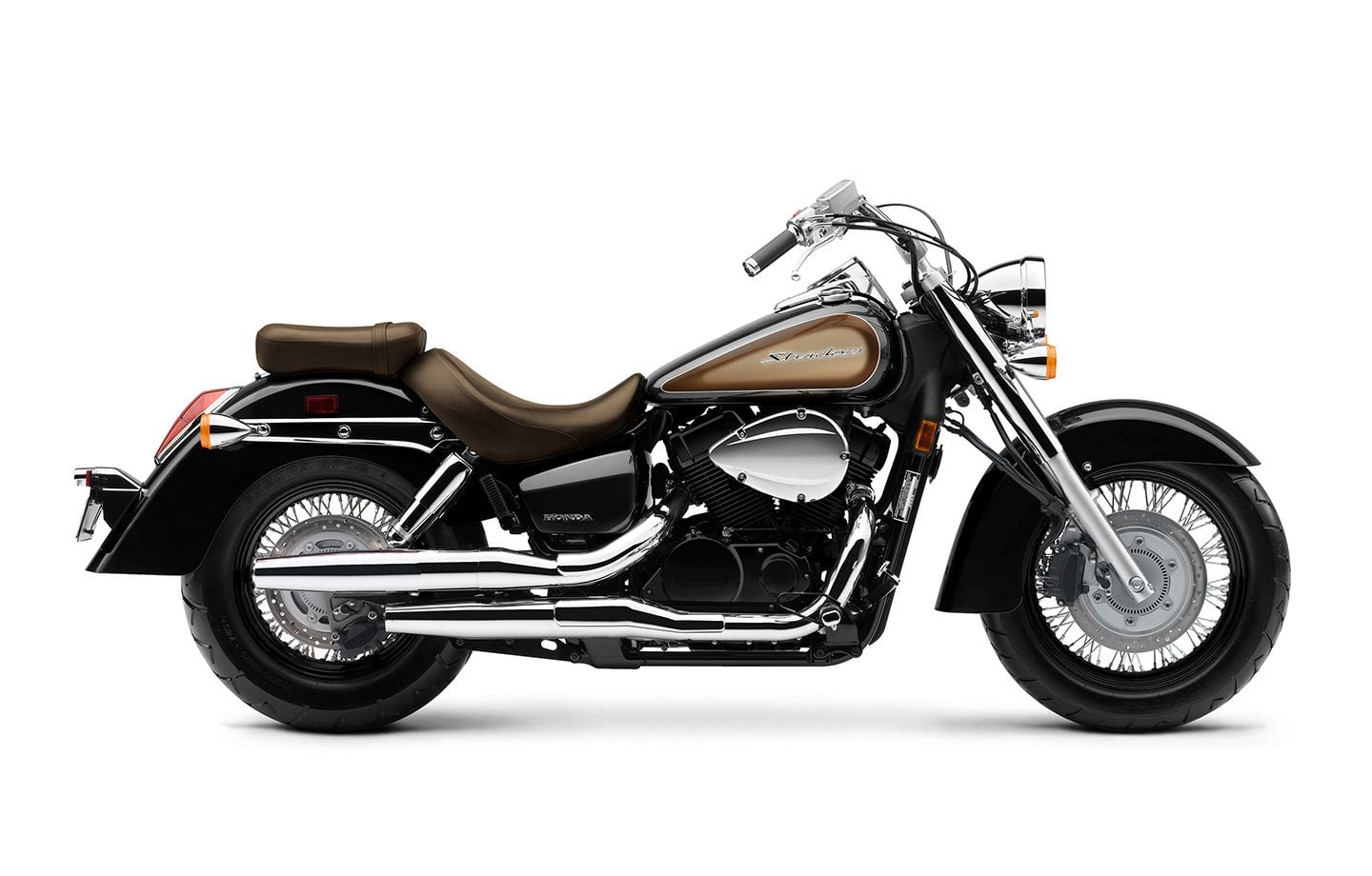 The 2024 Honda Shadow Aero, now with rear disc and optional ABS. Shown here in black, tan, and brown.