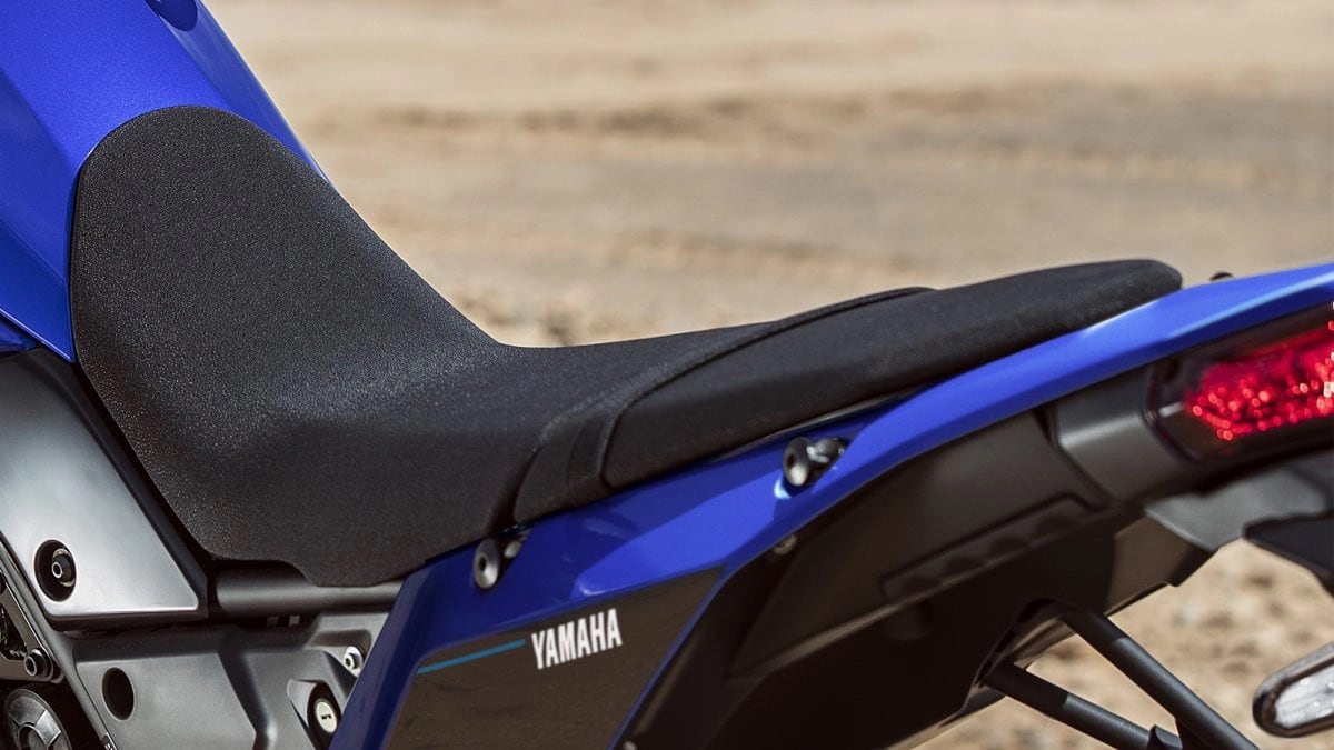 The stock Ténéré 700 seat dips low for a manageable seat height. Yamaha's optional one-piece rally seat ($219.99) sits 1.6 inches taller for added comfort, for taller riders.