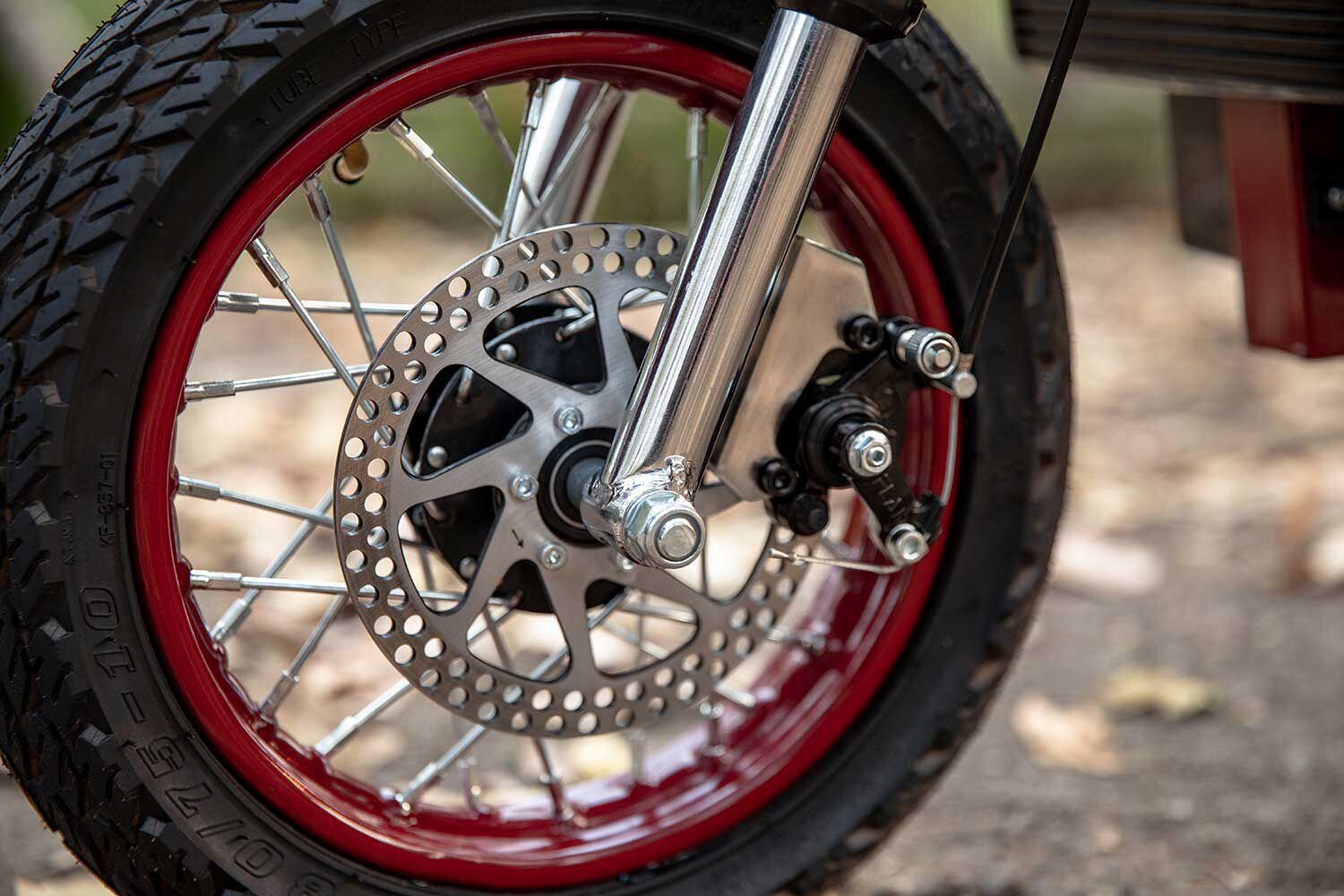 Lever-actuated dual brakes bring the eFTR to a stop.